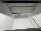 a white refrigerator with a window in the middle of it