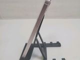 a cell phone that is sitting on a stand