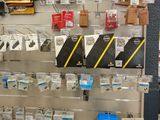 many different types of electronics on display in a store