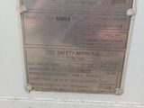 a sign on the side of a building stating that there is an approved for transport under customs seal