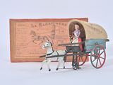 toy figurine of a horse pulling a covered wagon with a woman in it