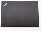a black laptop with a sticker on it