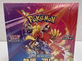 a close up of a box of pokemon cards on a table