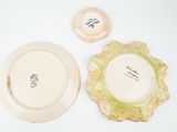 two plates and a bowl are sitting on a table