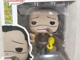 funko pop vinyl figure of a man holding a banana in his hand