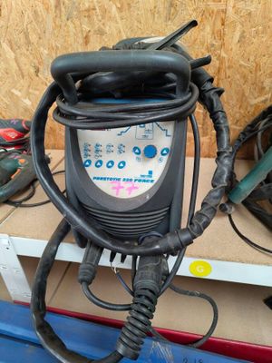 a small air compressor sitting on top of a pallet