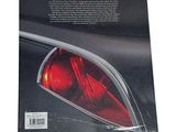 an image of a book with a picture of a car ' s tail light