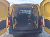 a yellow van with its doors open on the side of the road