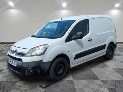 the white van is parked in a room with a checkered floor