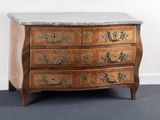 a marble top chest of drawers on a grey carpeted floor