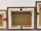 three wooden boxes that are sitting next to each other