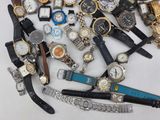 a lot of watches that are laying on a table