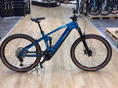 a blue bike that is on display in a store