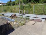 a fence that is next to a ramp that has fallen over