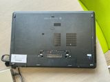 a laptop computer sitting on top of a table