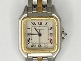 a silver and gold watch with roman numerals on it
