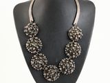 a close up of a necklace on a mannequin on a mannequin