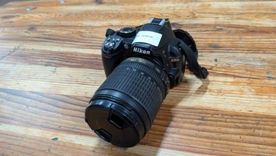 a camera that is sitting on a wooden table