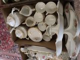 a lot of tea cups and saucers in a box