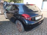 a picture of a black car parked on the side of the road