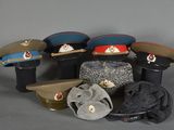 several hats and hats sitting on top of each other on a table