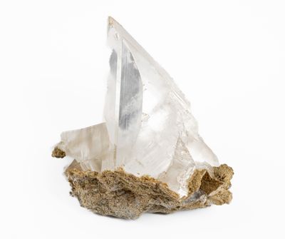 a close up of a piece of rock with a crystal on it