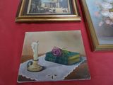 a picture of a painting and a picture of a vase of flowers on a table