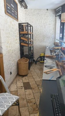 a long table with a laptop on it in a room