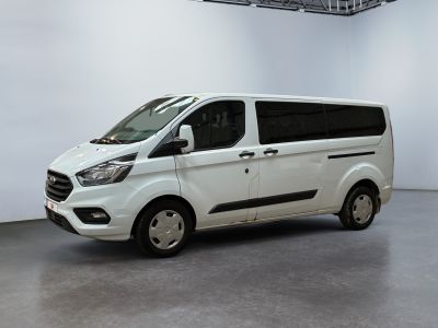 the white van is parked in a large room with a white wall