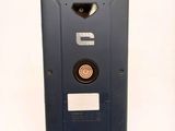 a close up of a cell phone on a white surface