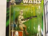 star wars action figures sit on a table in front of a magazine