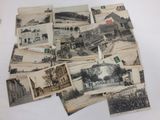 several old black and white photos of a bunch of buildings