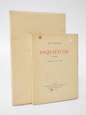 two books sitting on top of each other on a white surface