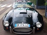 a black sports car parked on the side of the street