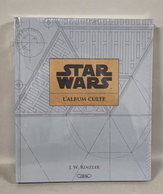 a book with a star wars logo on it sitting on a table