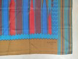 an image of a blue, red, and brown scarf with a design on it