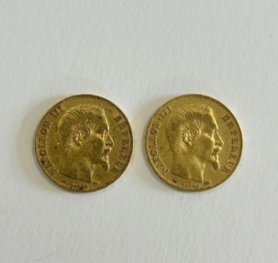 two gold sovereigns, one of which has a head of a man and the other of a woman