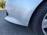 a close up of a car ' s tire on the road