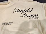 an image of a white jacket with the words amiist dreams and reality written on it