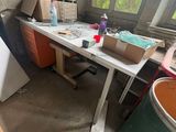 a table with a lot of stuff on it in a room