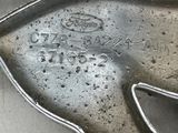 a metal spoon with a metal handle on a table