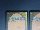 two decks of magic the gathering are shown on a table