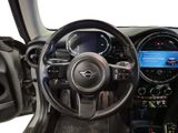 the interior of a car with a steering wheel, dashboard, and dashboard controls