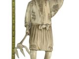 statue of a man with a sword and a ruler in front of a white background