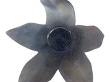 an image of a glass flower with a black center