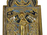 a gold and blue plaque with an image of a woman holding a child