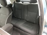 the back seats of a car are black and grey in color