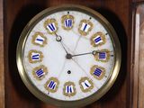 a clock with roman numerals on the face of it