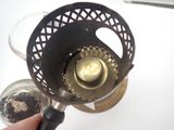 a person that is holding a metal object in their hand