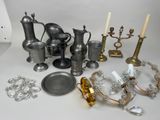 a lot of silver and gold items on the table